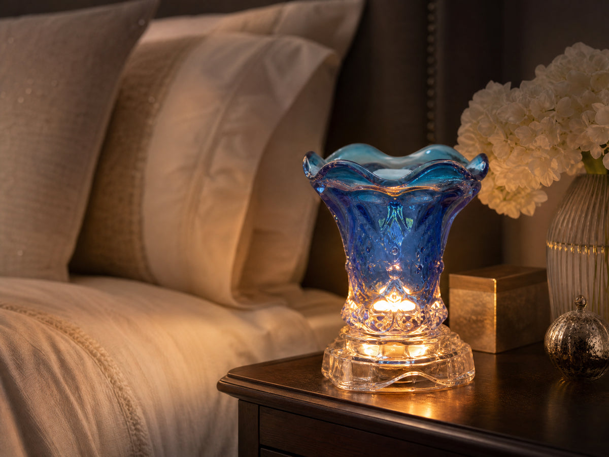 Crystal glass oil warmer in luxury bedroom setting